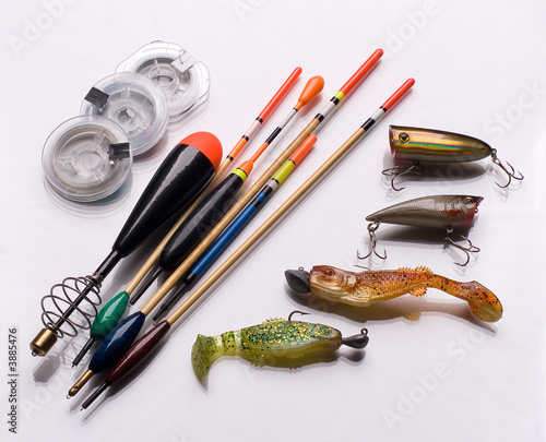 Fishing accessories of different colors lay 
