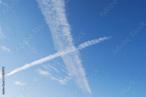 Photos Clouds kiss across a blue sky