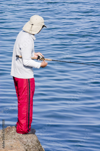 Man fishing at the coast