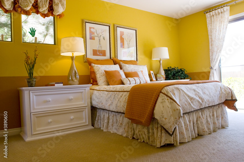 Modern tastefully decorated master bedroom photo