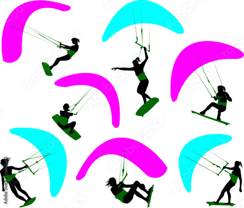 Silhouettes of the women who are engaged of kite surfing.
