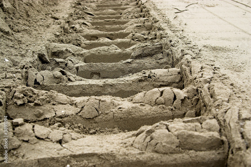The track of the caterpillar on the sand