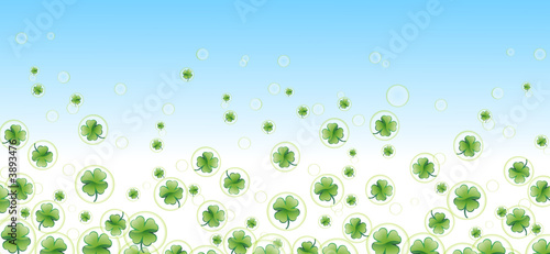 more four-leafed clover in bubbles with blue background
