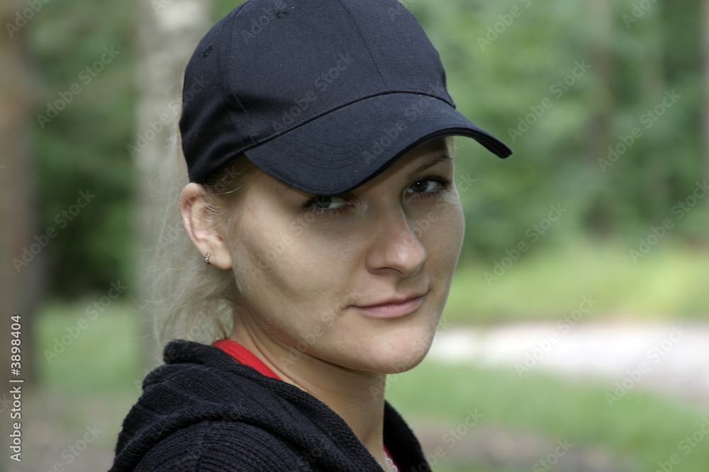 European blondie girl in a black cap. European blondie girl in a black cap.