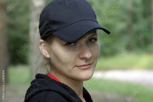 European blondie girl in a black cap.