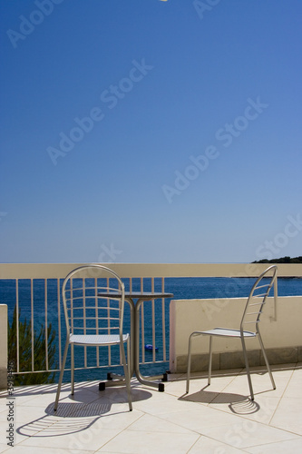 Two chairs and the blue sky