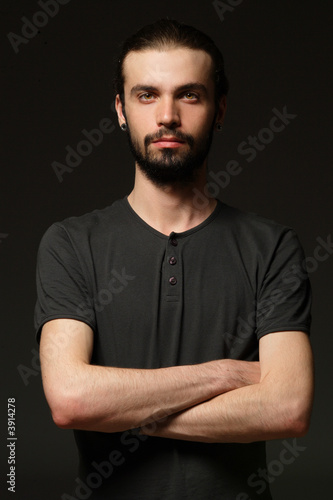 Принти на полотні young man portrait in a black background