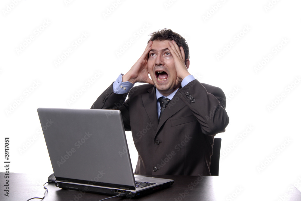young crazy man working with is laptop young crazy man working with is laptop