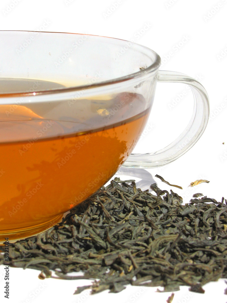 Сup of green tea with dry tea leaves on white background Сup of green tea with dry tea leaves on white background