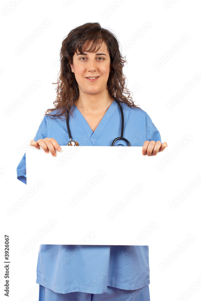 Friendly female doctor in blue scrubs, holding the blank placard Friendly female doctor in blue scrubs, holding the blank placard