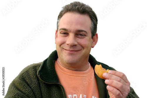 man eating a donut, isolated