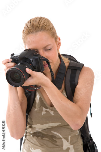 Young blond woman with big camera around her neck 