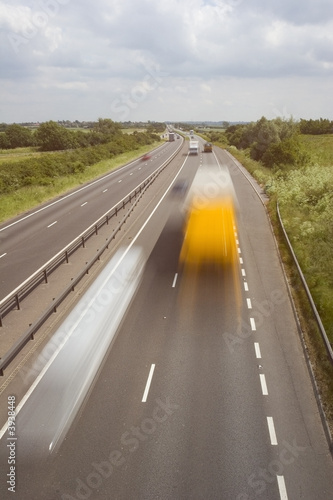 Blurred trucks speeding along a British highway © Ian Webb
