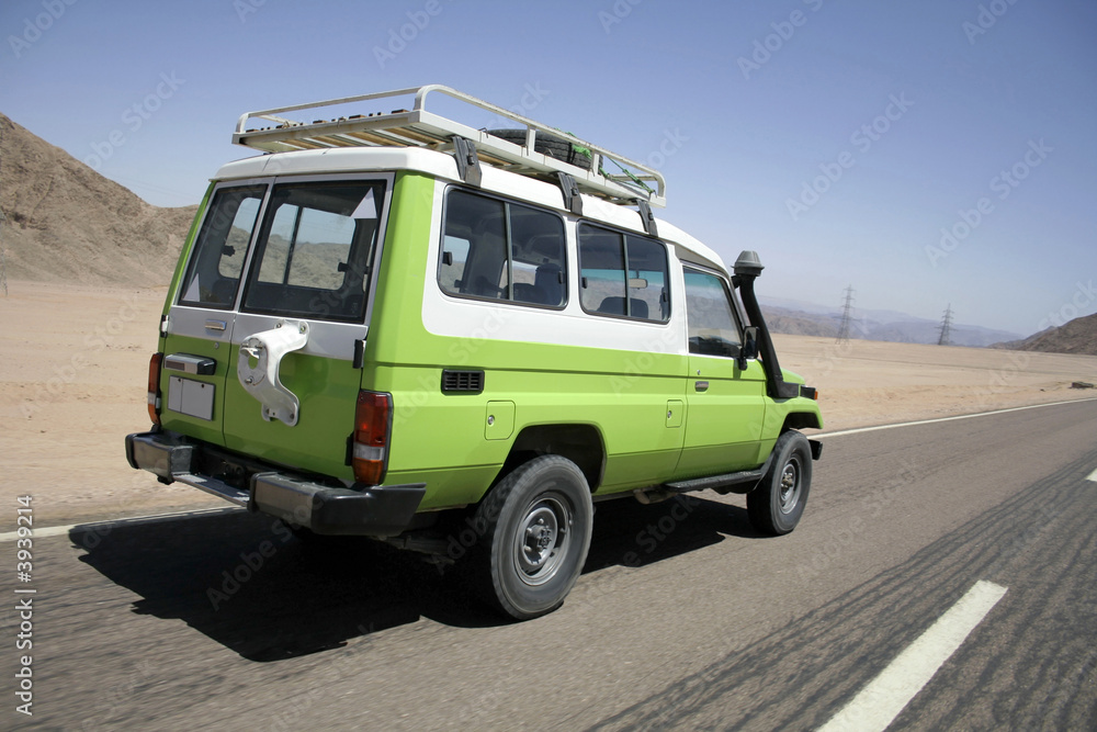 4 wheel drive overtaking on a desert road in sinai, egypt