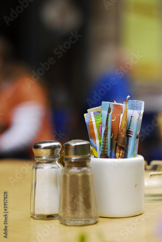 salt, pepper shakers and sugar packets