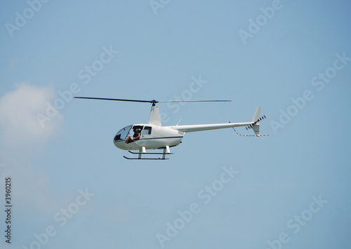 Light sightseeing helicopter in flight