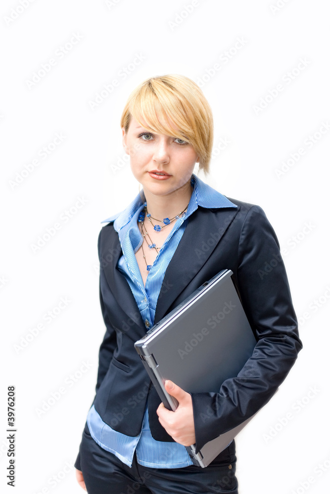 Businesswoman holding laptop under one's arm Businesswoman holding laptop under one's arm