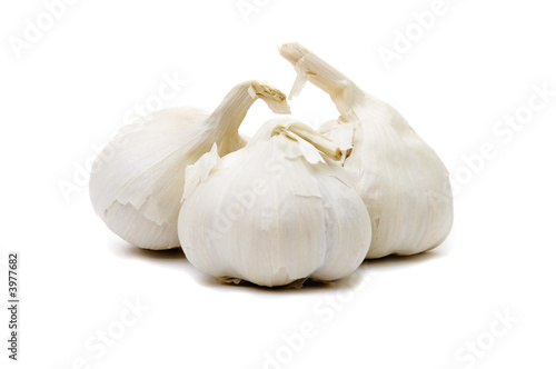 Three garlic bullbs on white