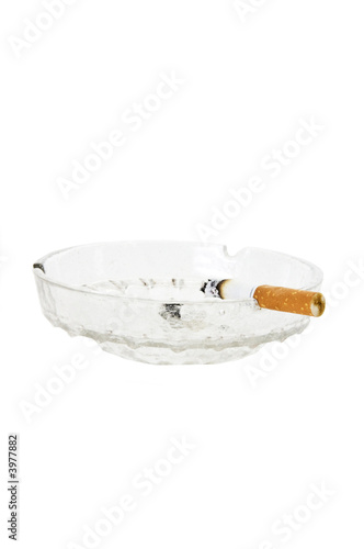 Cigarette showing nicotine stain on filter in ashtray