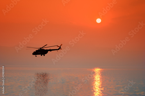 Helicopter at sunset photo