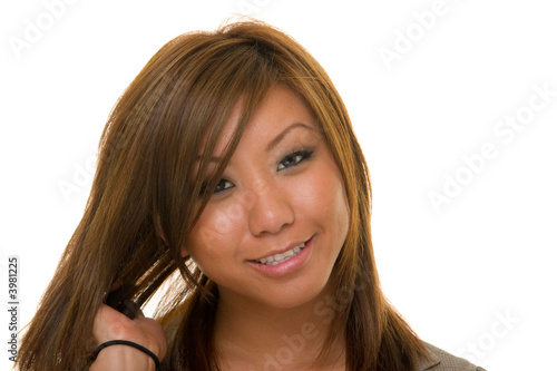 Asian Woman Straightening Hair