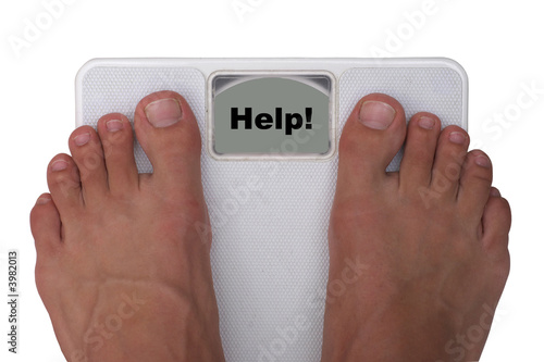 Male feet on a scale. Showing 
