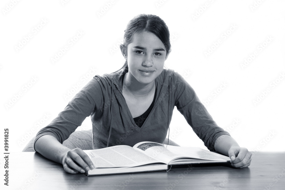 A young woman reading in the library A young woman reading in the library