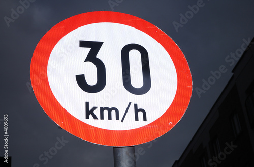 An Irish 30 kmh speed sign in the dark night sky. © Sharpshot
