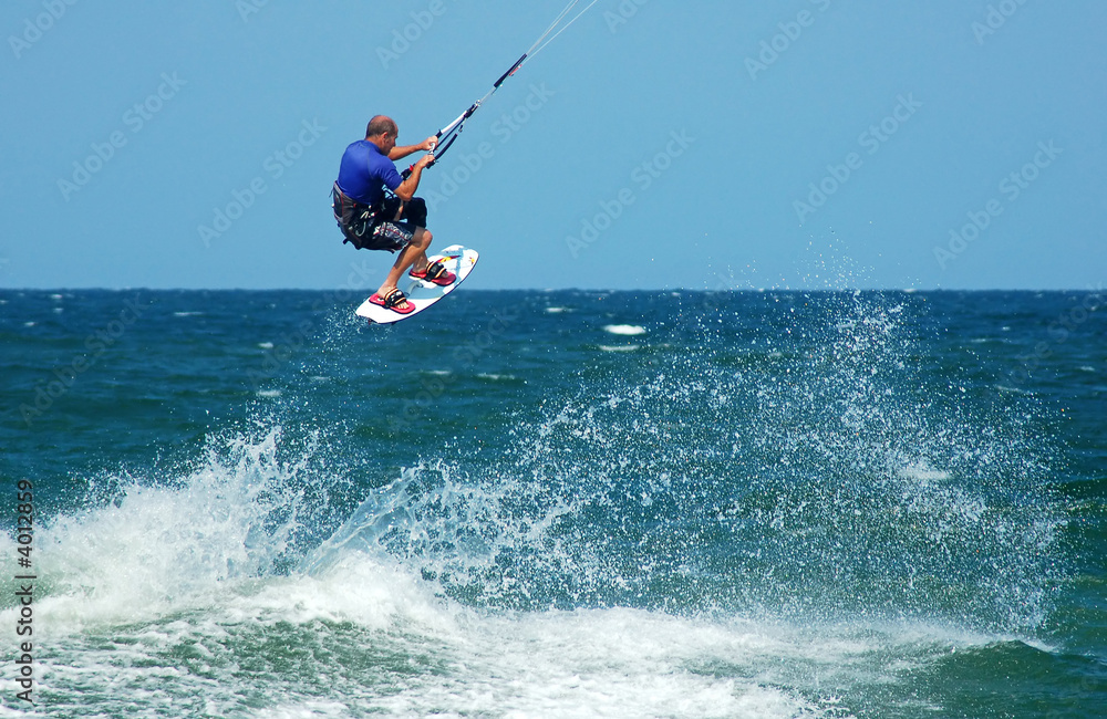 Photo of male kite boarder. Photo of male kite boarder.