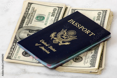 United States Passport on Stacks of One-hundred Dollar Bills