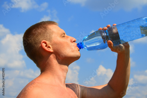 yong man drink a water