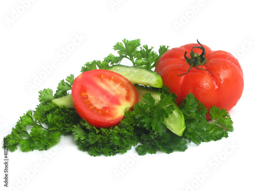 Cucumbers, tomatoes and greens, close up