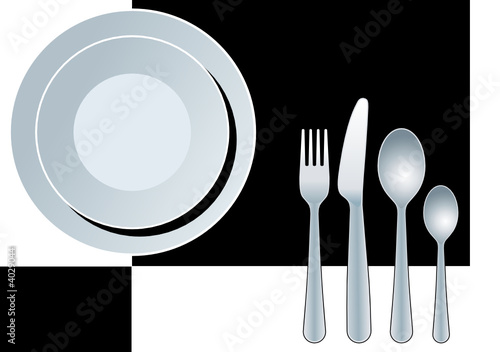 Place setting, plate, fork, spoon and knife.