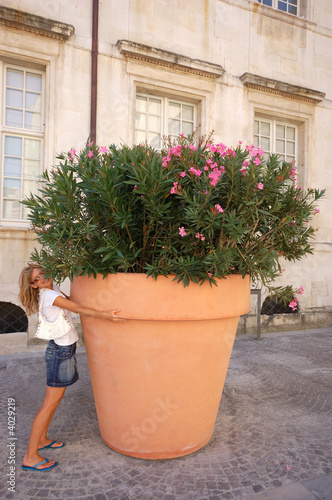 Girl and big flower pot