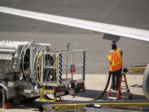 Man refueling commercial jet