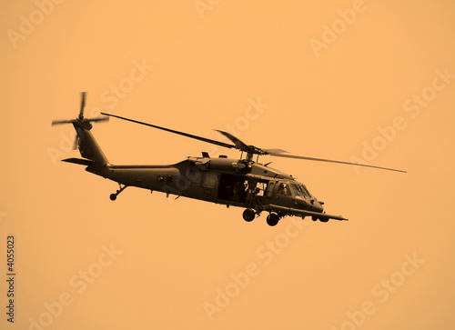American military helicopter at sunset