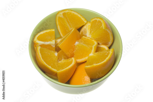 Bowl of cut oranges..