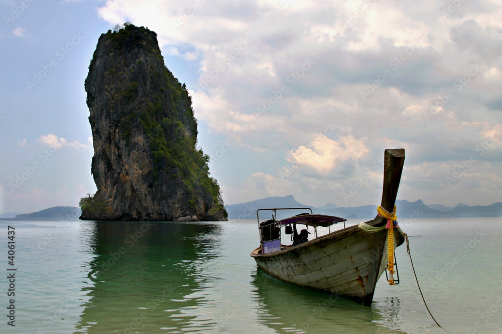 Long-tail boat and the rock