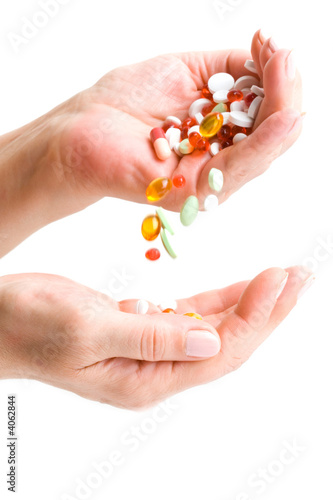  Hand pouring down bunch of pills