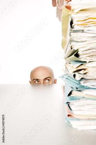 Man stares at files photo