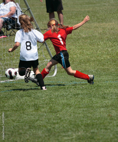 Youth Soccer or Football Player in Action 12