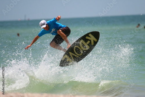 surfer jumping on waves