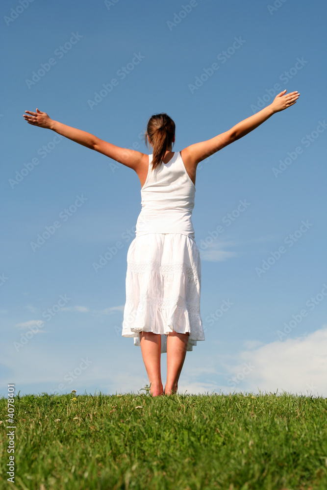 Woman with arms outstretched 