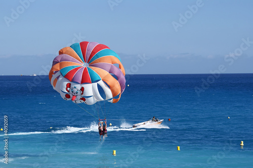 a motorboat with parachute prepared for parasailing