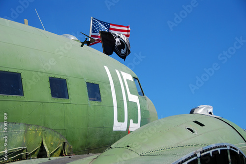 Vintage airplane with pow flag photo