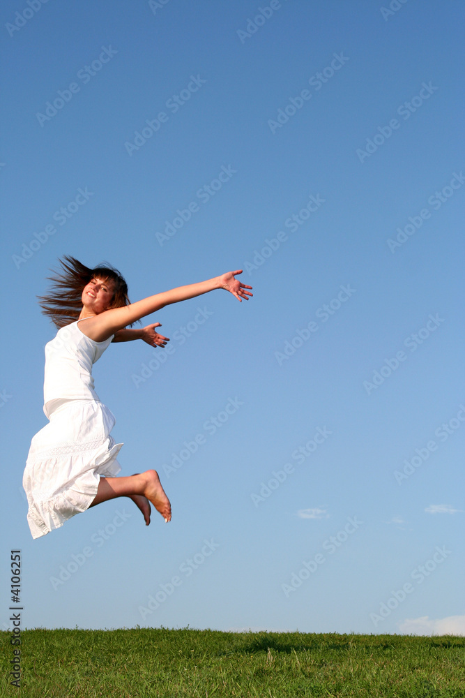 Happy woman jumping against blue sky Happy woman jumping against blue sky