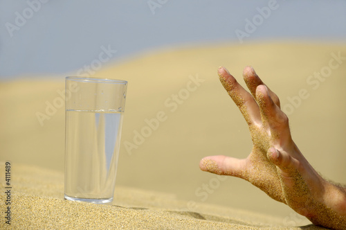 Fotografie Hand reaching for water.