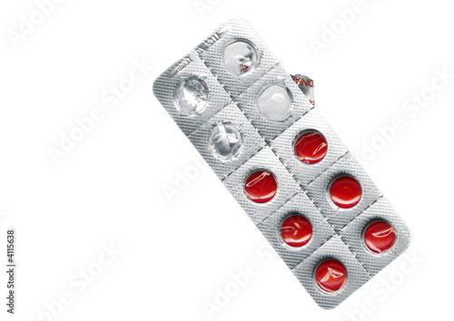 blister with red pills isolted on a white back ground