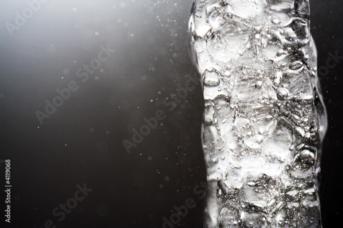 Water Jet frozen in silver background