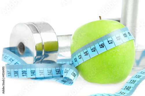 Dumbbells and apple. A healthy way of life